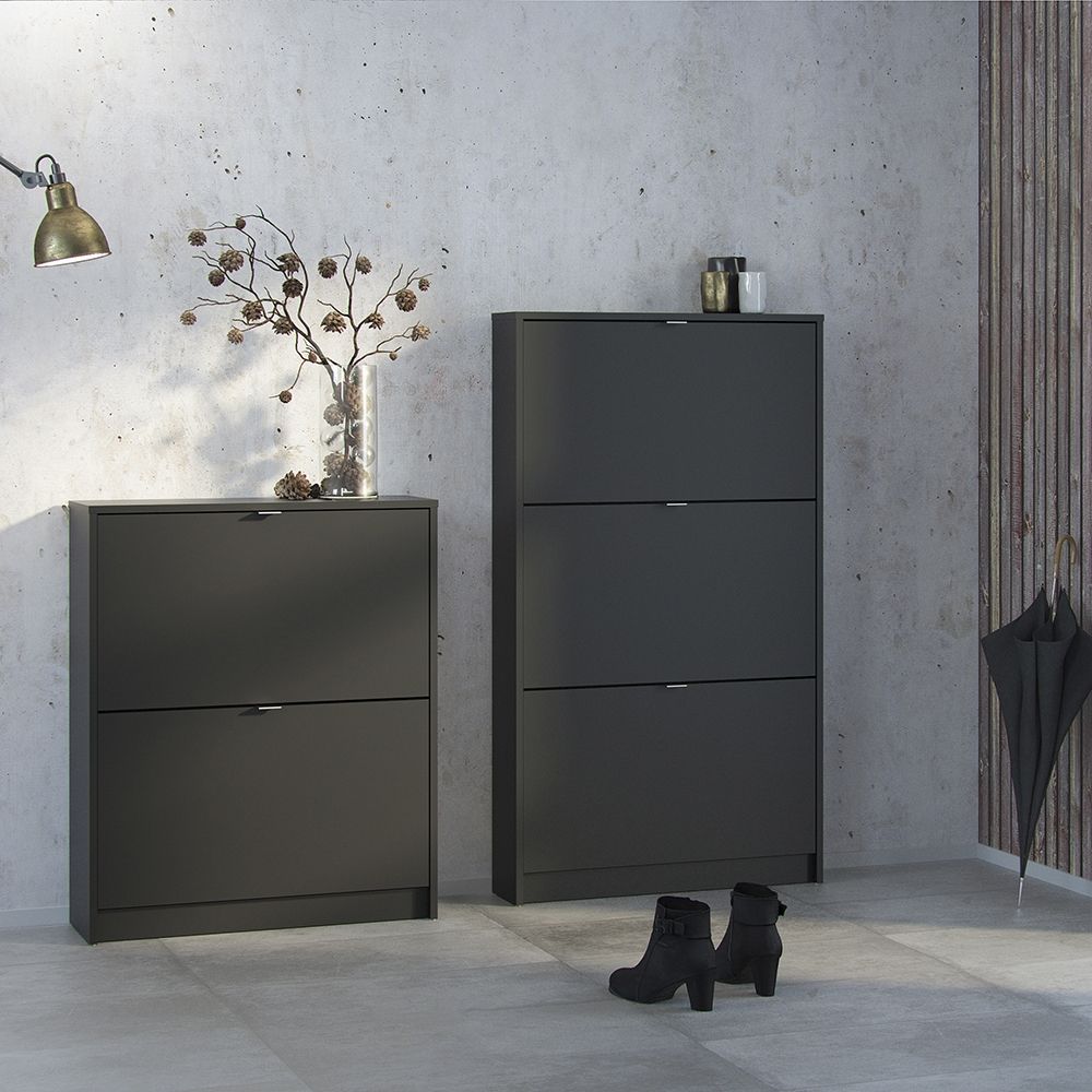 Chester Shoe Cabinet. Flip Down Shoe Storage. Matt Black Shoe Cabinet. Modern Shoe Organiser. Efficient Shoe Storage. Durable Shoe Cabinet. Tilting Doors. Contemporary Shoe Storage. Minimalist Design. Scratch-Resistant Material. Easy-to-Clean. High-Quality Fixings. Versatile Storage. Durable Storage Solution. UK Stockist. Next Day Delivery. Stylish Footwear Organizer. Sustainable Furniture. Practical Shoe Storage. Compact Shoe Cabinet. Furniture. Home Decor.