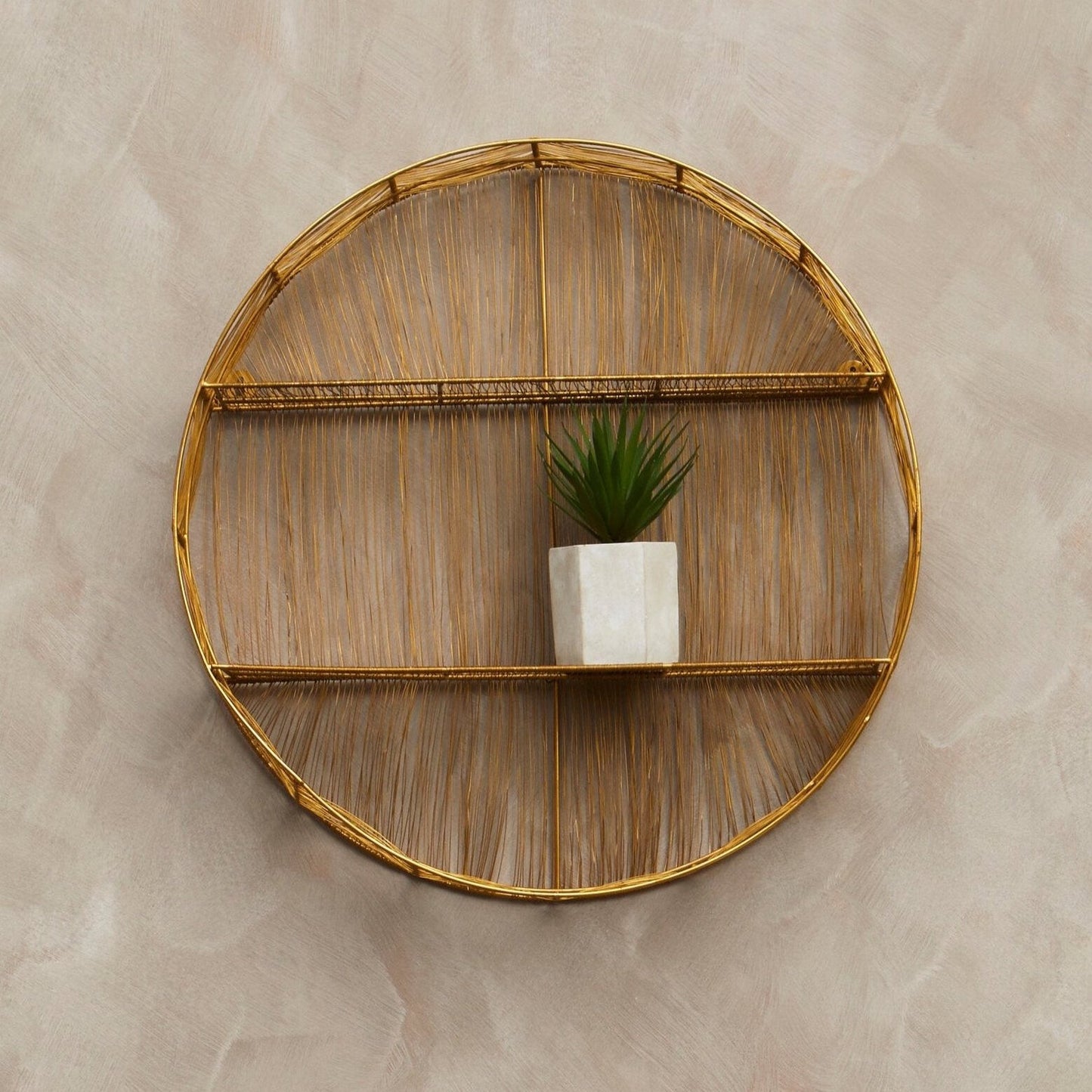 Elio Round Wall Shelf. Gold & Black Wall Shelf. Modern Circular Shelf. Industrial Glam Shelf. Versatile Wall Shelf. Contemporary Wall Décor. Striking Shelf Design. Decorative Wall Shelf. Minimalist Wall Shelf. Two-Shelf Display. Living Room Shelving. Bedroom Wall Shelf. Entryway Shelf. Functional Wall Décor. Sturdy Iron Frame Shelf. Industrial Chic Shelf. Sophisticated Wall Shelf. UK Stockist. Quick Delivery. Modern Home Shelf. Decorative Metal Wall Shelf. Contemporary Home Accent.